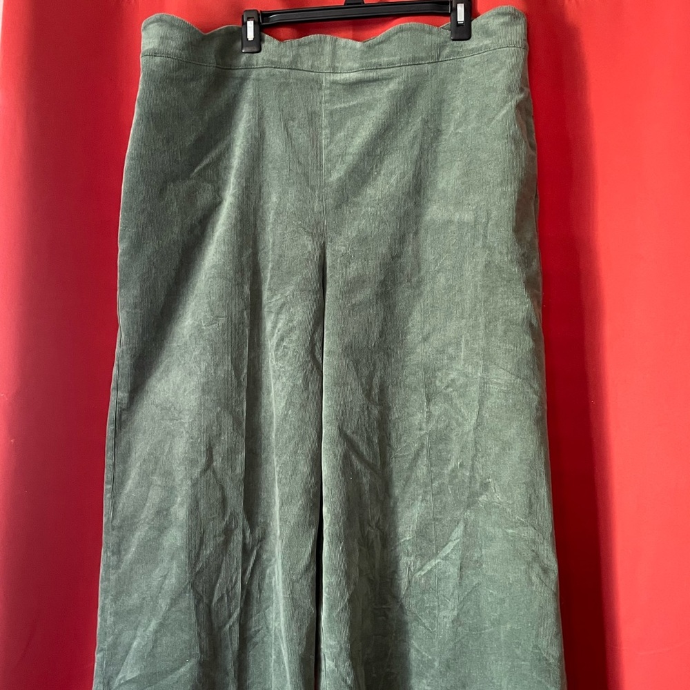 Sage green corderoy, wide leg women’s pants with scalloped waist ban.